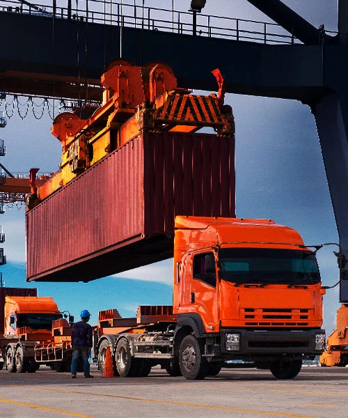 Containers loading on a orange truck